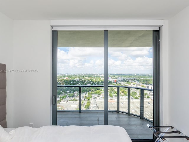 bedroom featuring a wall of windows