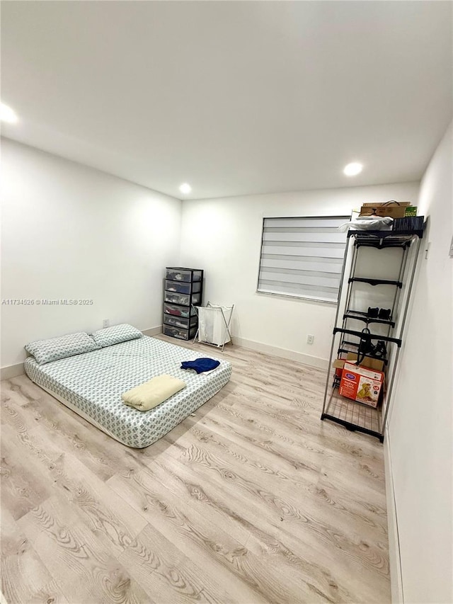 bedroom with wood-type flooring