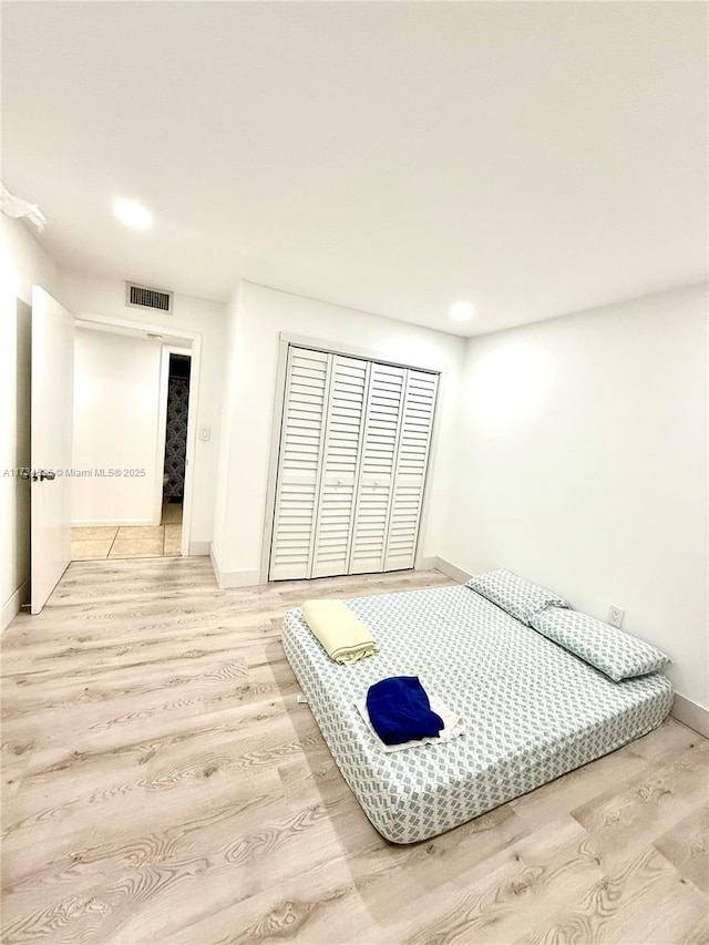 bedroom featuring light hardwood / wood-style floors