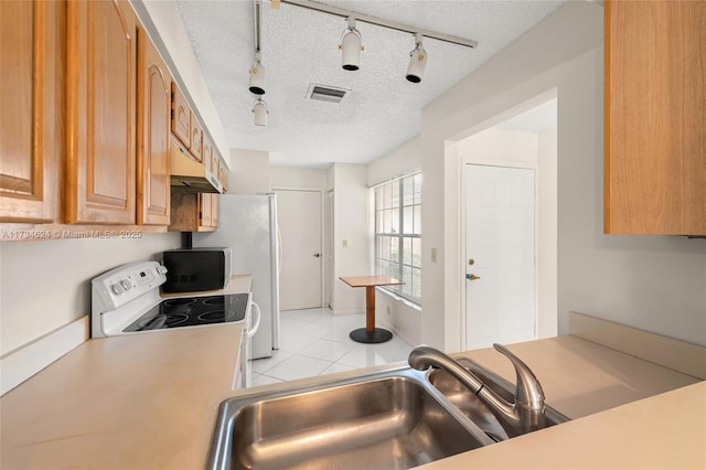 10836 Cypress Glen Dr, Coral Springs, FL 33071 - kitchen with sink, light tile patterned floors, white electric range oven, track lighting, and a textured ceiling