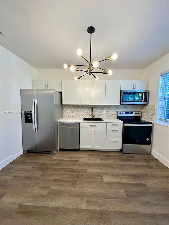 kitchen with white cabinetry, appliances with stainless steel finishes, and sink