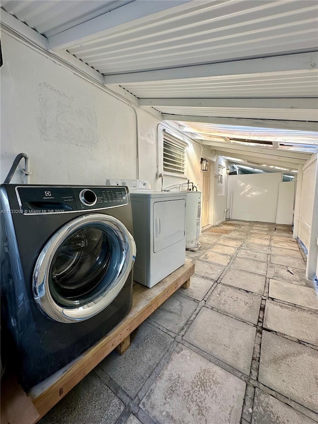 laundry room featuring washing machine and dryer