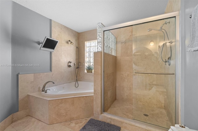 bathroom featuring tile patterned flooring, plus walk in shower, and a textured ceiling