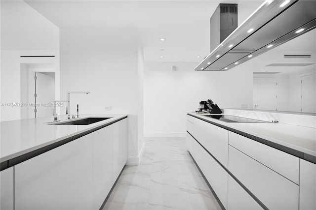 kitchen with black electric cooktop, island exhaust hood, sink, and white cabinets