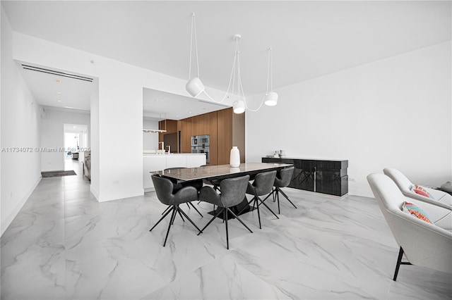 dining space featuring wooden walls