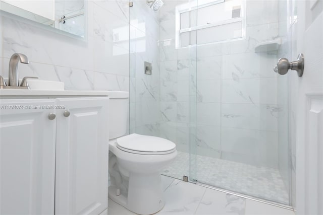 bathroom with vanity, a shower with shower door, and toilet