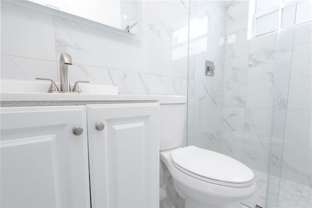 bathroom with vanity, an enclosed shower, and toilet