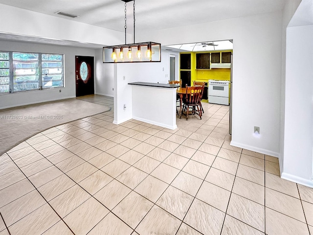 kitchen with pendant lighting and electric range