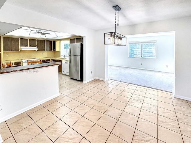 kitchen with ceiling fan, white appliances, and light colored carpet