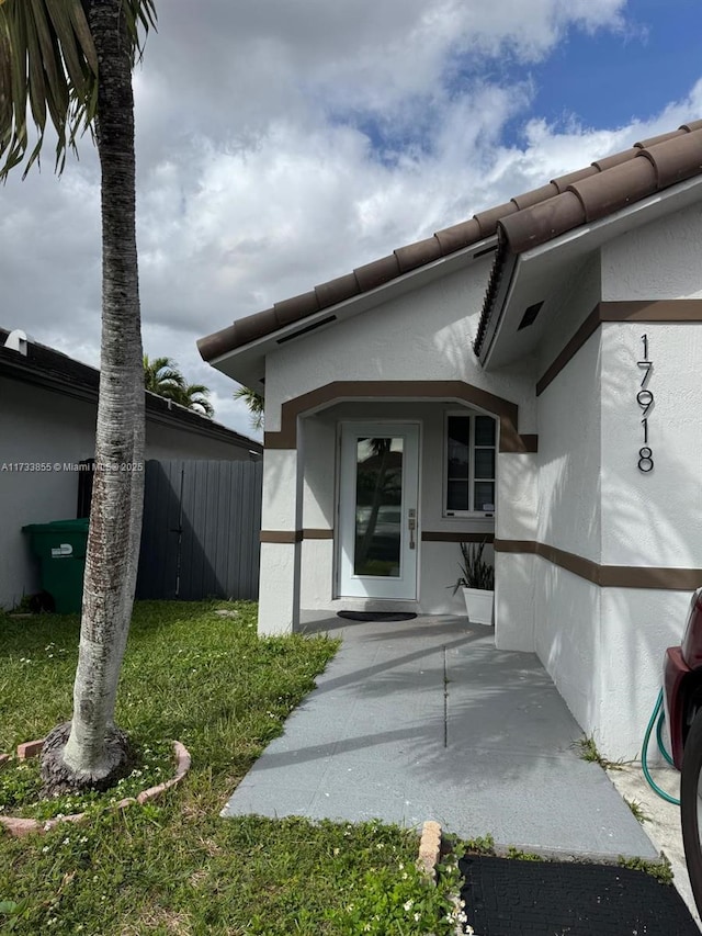 property entrance with a patio