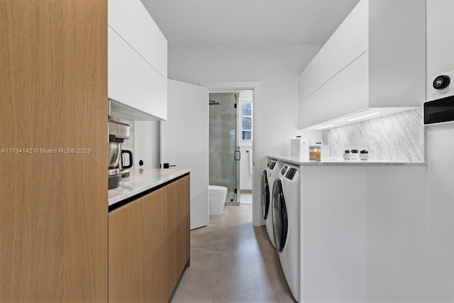 laundry room with independent washer and dryer