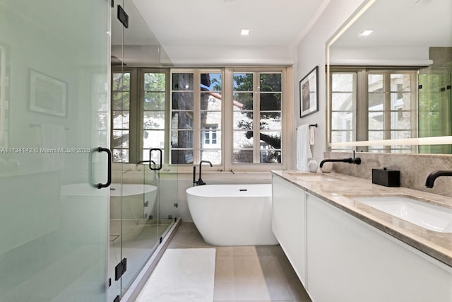 bathroom featuring vanity, tile patterned floors, and plus walk in shower