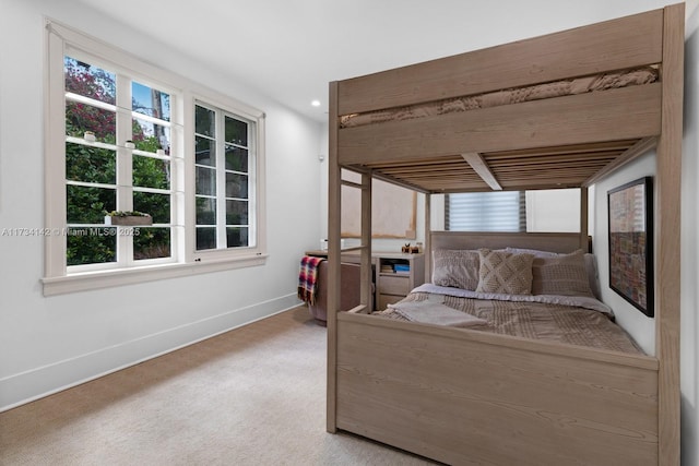 bedroom featuring light carpet