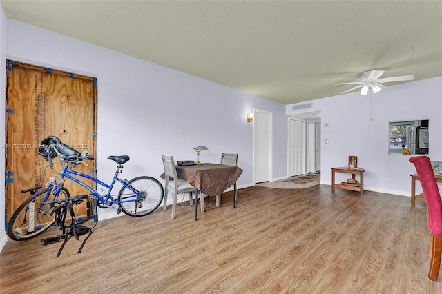 interior space with light hardwood / wood-style flooring and ceiling fan