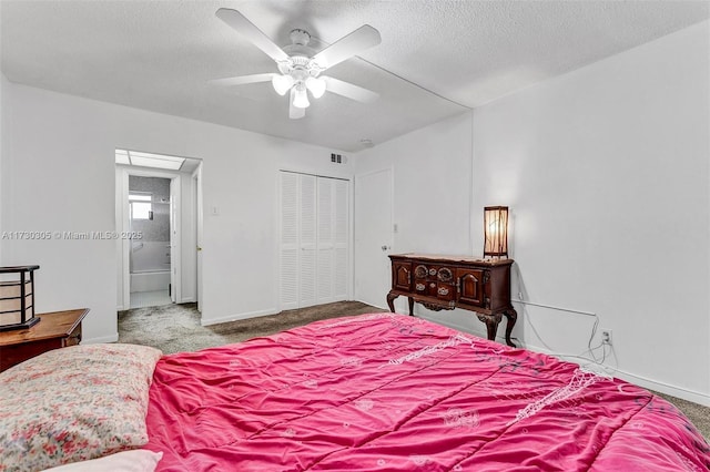 bedroom featuring ceiling fan, carpet flooring, a closet, and a textured ceiling