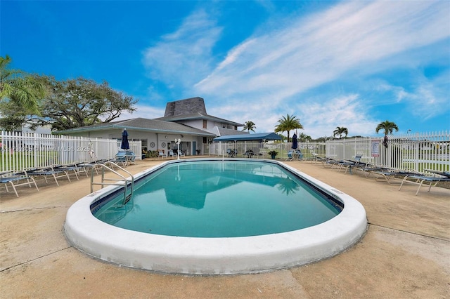 view of swimming pool with a patio area