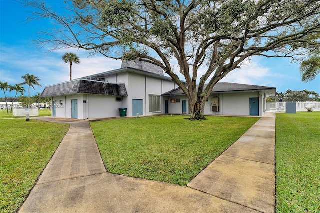 view of front of property with a front lawn