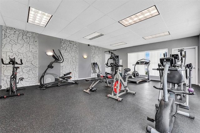 workout area featuring a drop ceiling