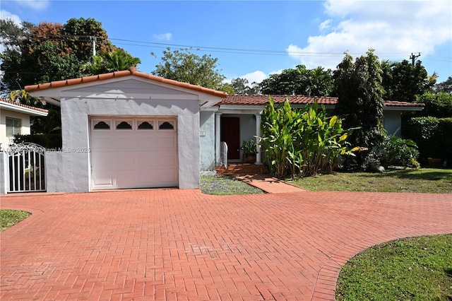 mediterranean / spanish-style home featuring a garage