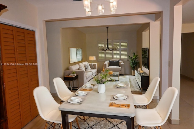 dining space with a chandelier