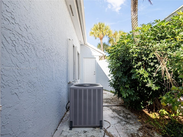 view of side of property featuring central AC