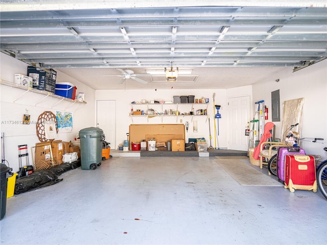 garage with a garage door opener and electric panel