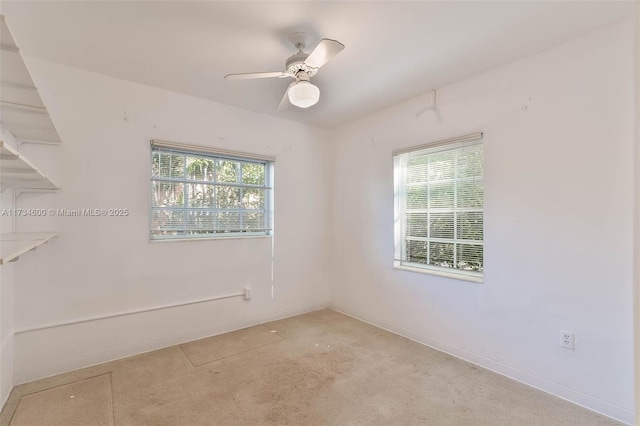 empty room featuring ceiling fan