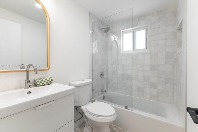 full bathroom with enclosed tub / shower combo, vanity, and toilet