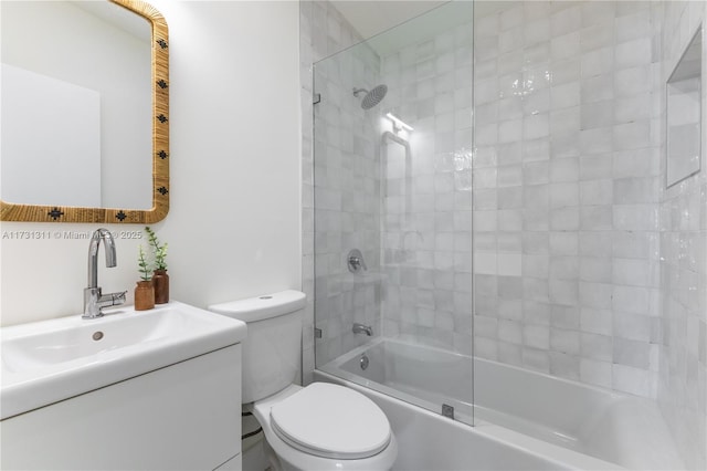 full bathroom with vanity, washtub / shower combination, and toilet