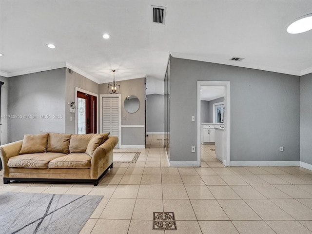 living room featuring light tile patterned flooring, ornamental molding, and vaulted ceiling