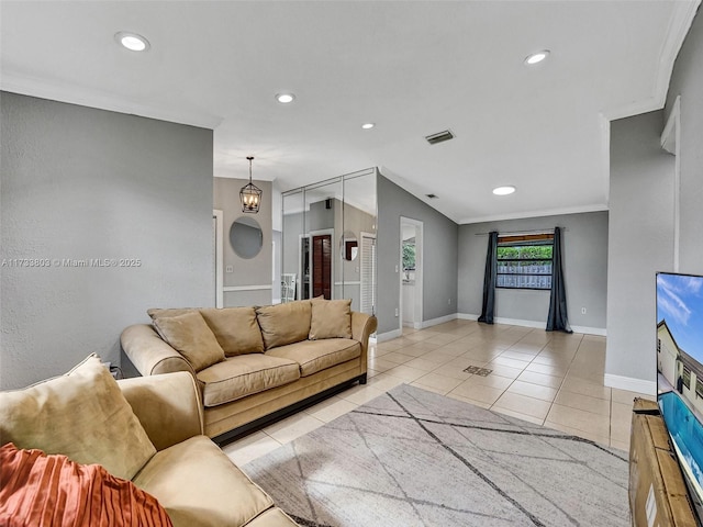 living room with crown molding and light tile patterned flooring