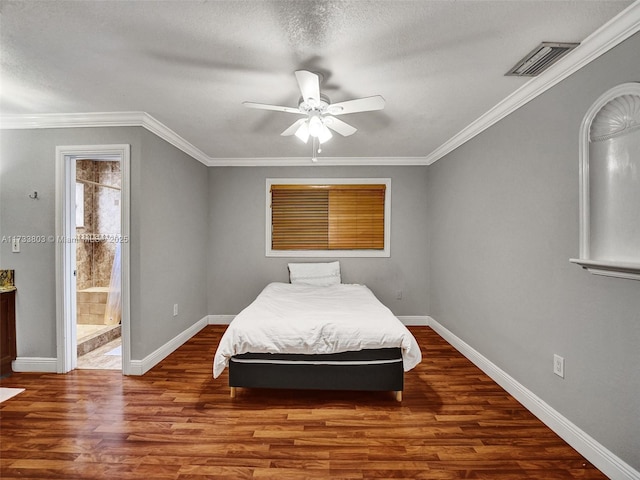 bedroom with crown molding and dark hardwood / wood-style floors