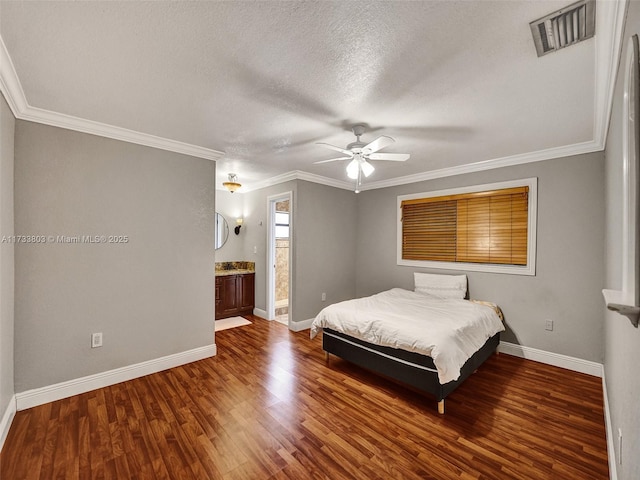 bedroom with ensuite bathroom, hardwood / wood-style flooring, ceiling fan, crown molding, and a textured ceiling