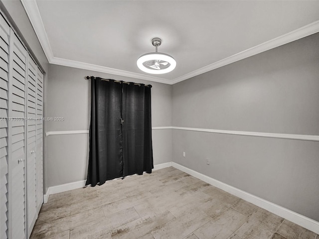 unfurnished room with ornamental molding and light hardwood / wood-style flooring