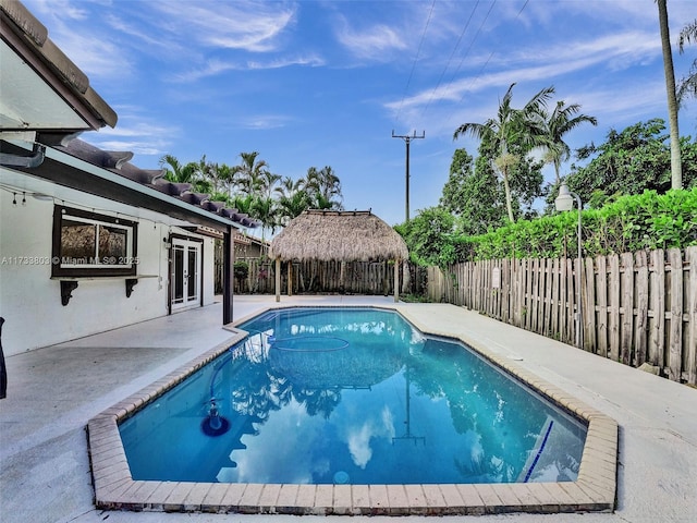 view of swimming pool with a gazebo and a patio