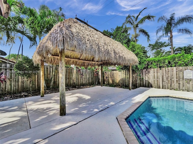 view of swimming pool with a gazebo and a patio area