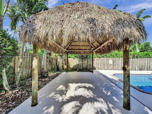 view of pool with a gazebo and a patio