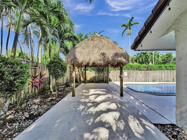 view of patio / terrace with a gazebo and a fenced in pool