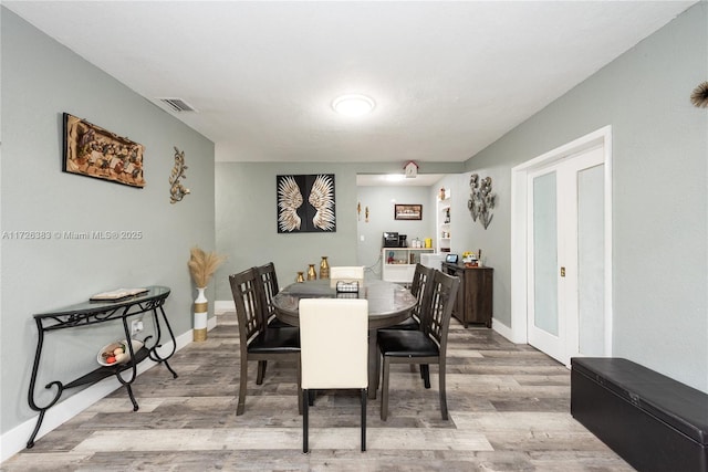 dining space featuring light hardwood / wood-style flooring