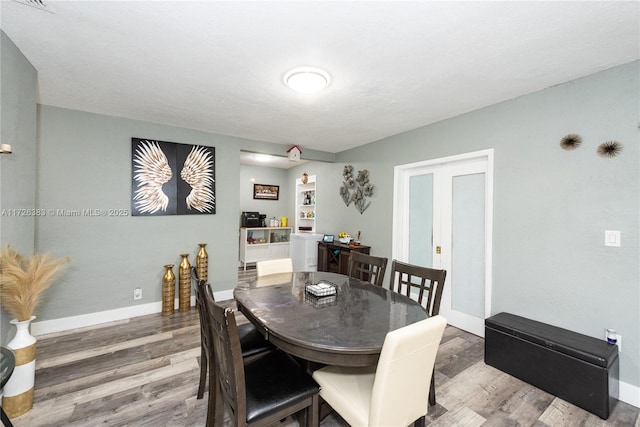 dining room featuring hardwood / wood-style flooring