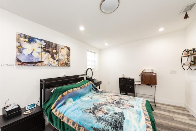 bedroom featuring light hardwood / wood-style flooring