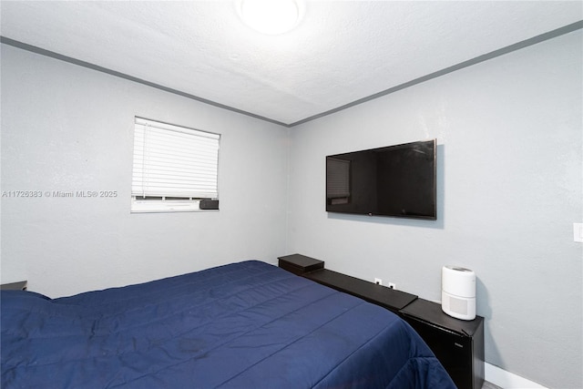 bedroom featuring a textured ceiling