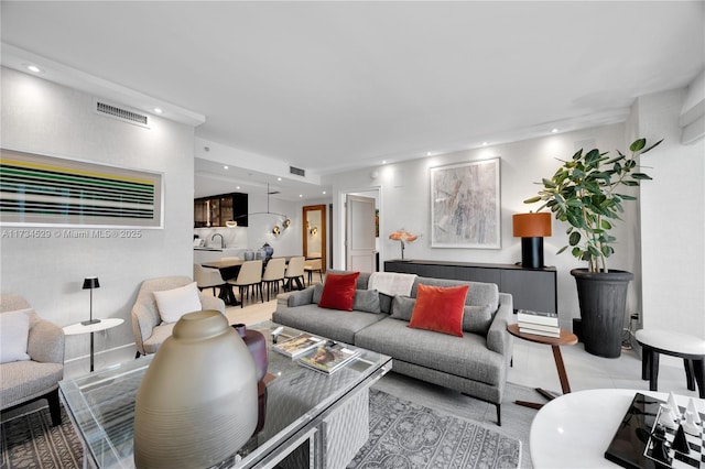 living room with sink and light tile patterned floors