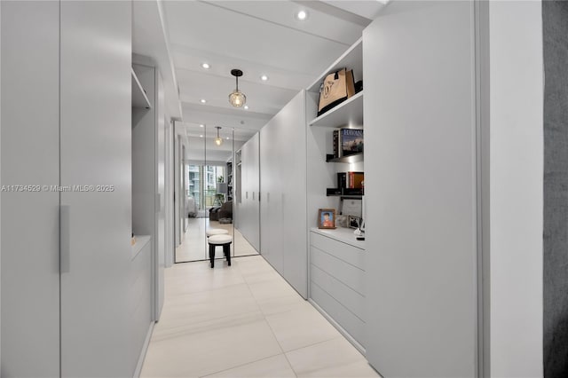 corridor with light tile patterned floors