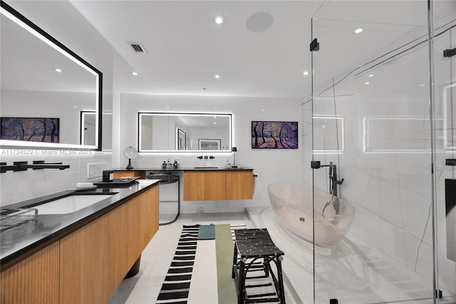 bathroom with vanity, backsplash, and independent shower and bath