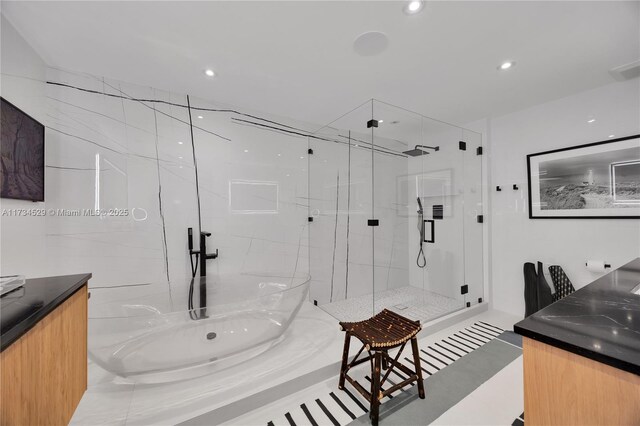 3400 SW 27th Ave Unit 704, Miami, FL 33133 - full bathroom with vanity, a marble finish shower, and recessed lighting