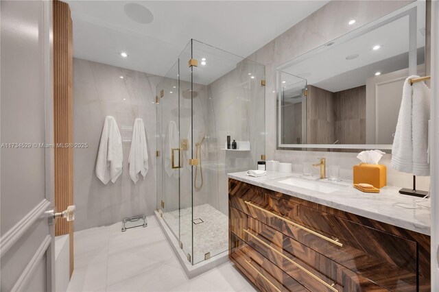 3400 SW 27th Ave Unit 704, Miami, FL 33133 - bathroom with vanity, a marble finish shower, and recessed lighting