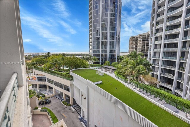 3400 SW 27th Ave Unit 704, Miami, FL 33133 - balcony with an area to practice putting and a city view