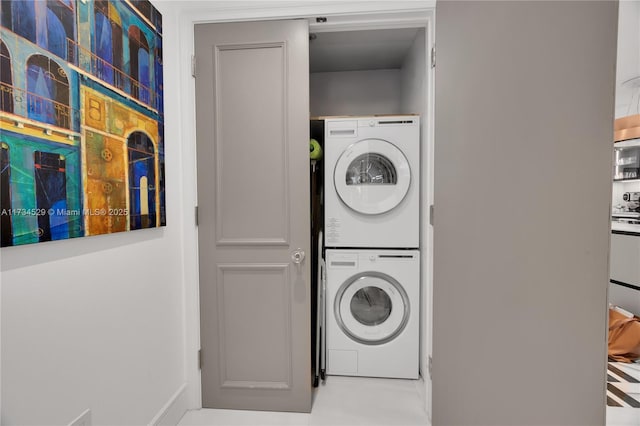 laundry area with stacked washer / dryer