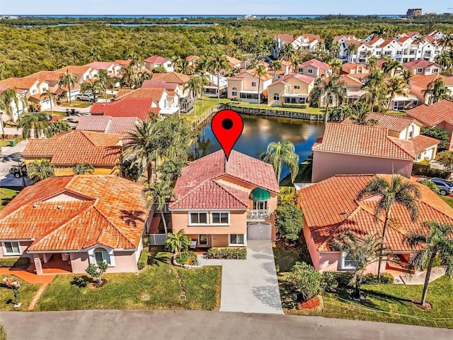 birds eye view of property featuring a water view